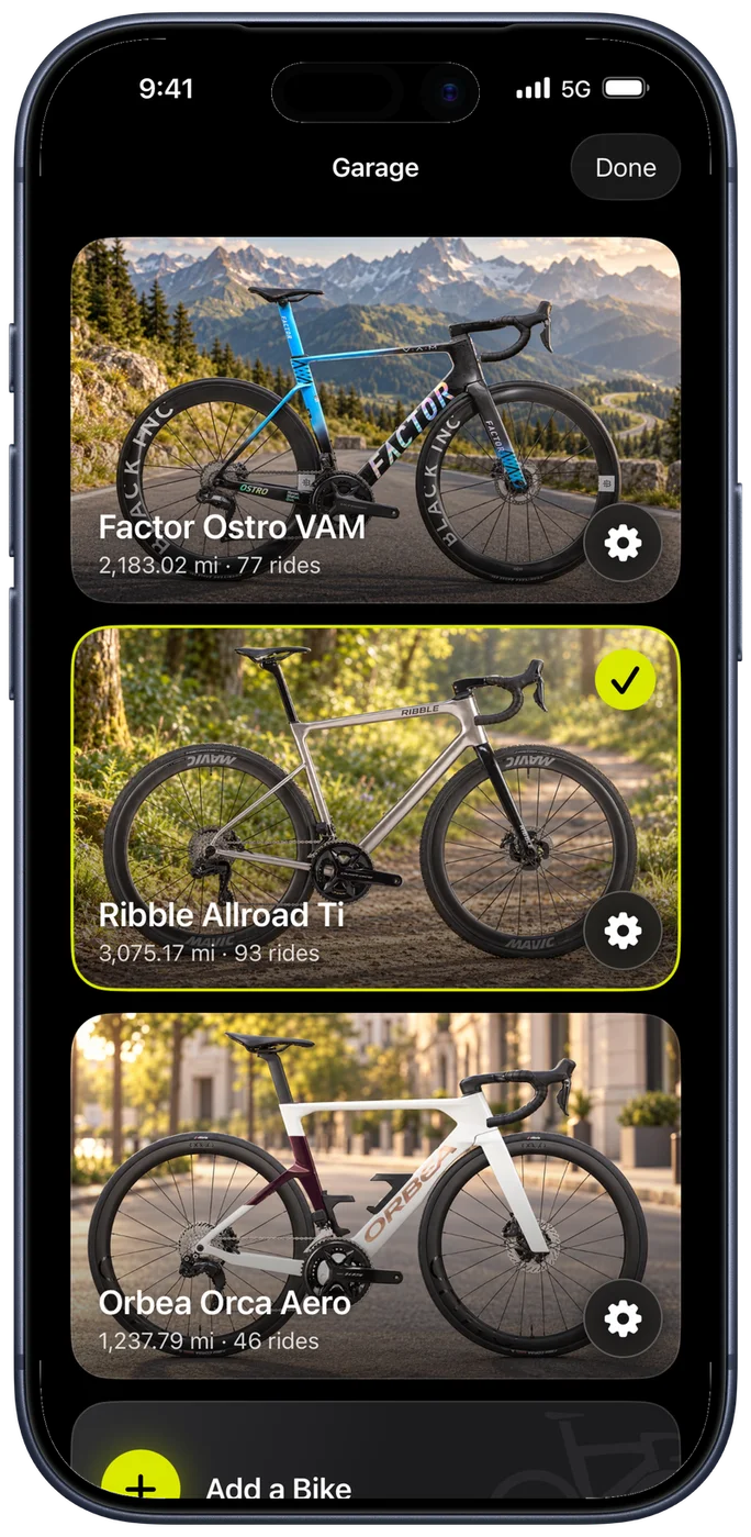 The Bike IQ garage showing three bikes as photo cards, each with its distance and ride count, and the current bike marked with an accent ring and a checkmark